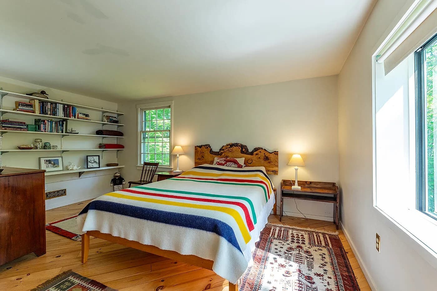 Bedroom 2 with a queen bed and built-in bookshelves