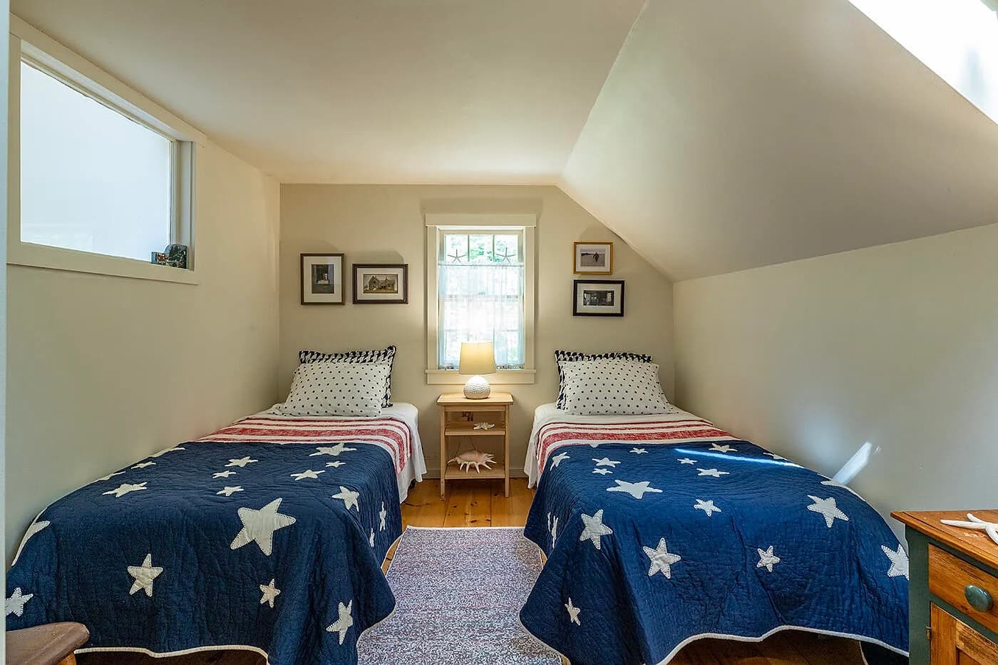 Bedroom 3 with two single beds and star quilts